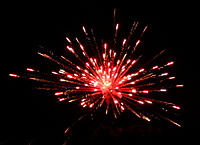 Photo of red firework exploding